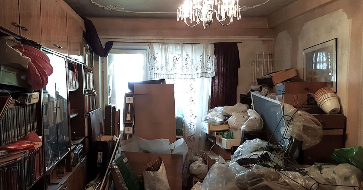 Photo of room in parent’s home that is filled unsafely with hoarded items and trash.